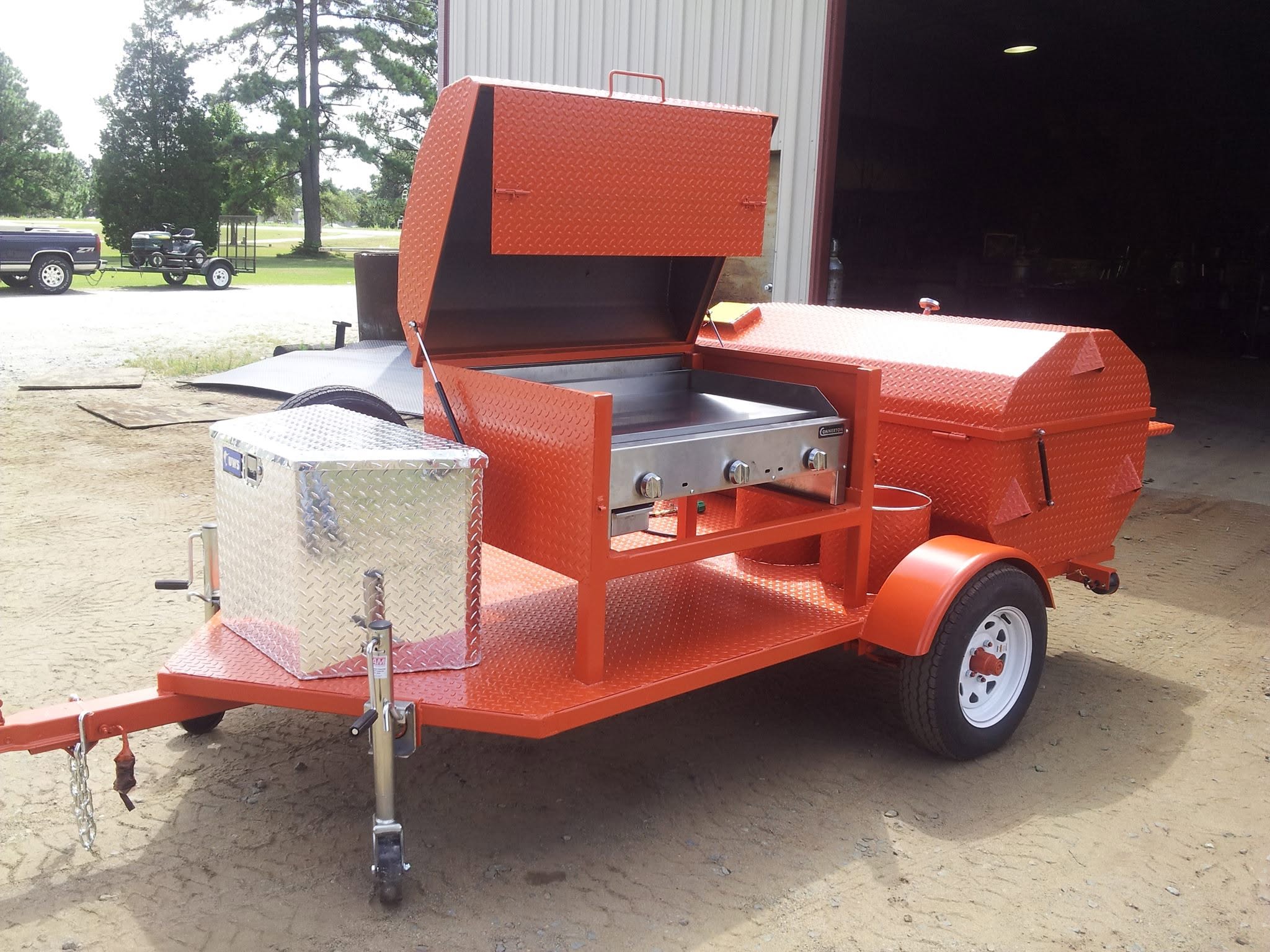 Finished custom orange cooker and griddle combo built by Big Larry's Cookers
